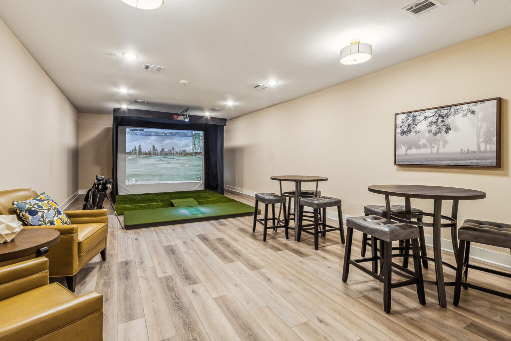 2310_Riverway_Dr_Conroe_TX_77304_USA-Living_room-IMG_4274 - Lakes at Woodhaven Social room and golf simulator at The Lakes at Woodhaven Village, a retirement community near Houston.